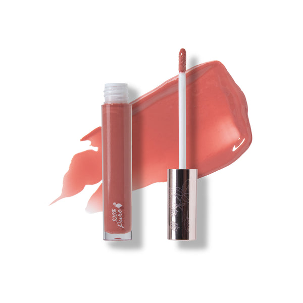 Lip gloss with applicator and swatch on a white background