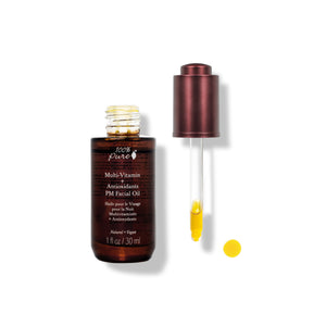 100% PURE Multi-Vitamin + Antioxidants PM Facial Oil in a 30ml amber bottle, packed with vitamins A, C, D3, E, CoQ10, and nourishing plant oils for anti-aging and radiant skin.