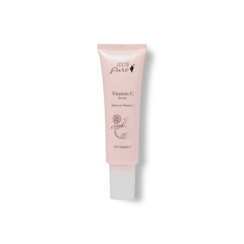 Pink skincare serum tube labeled '100% Pure Vitamin C Serum' on a white background