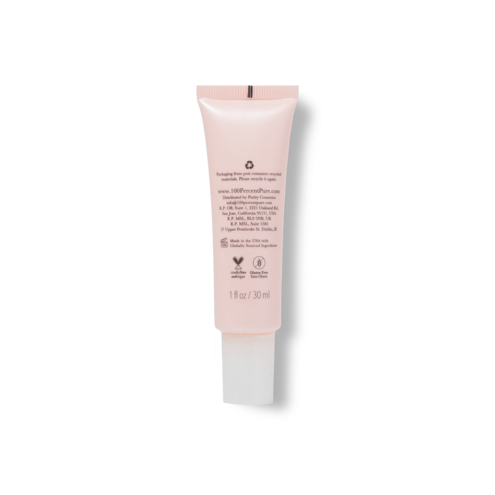 Pink skincare serum tube labeled '100% Pure Vitamin C Serum' on a white background