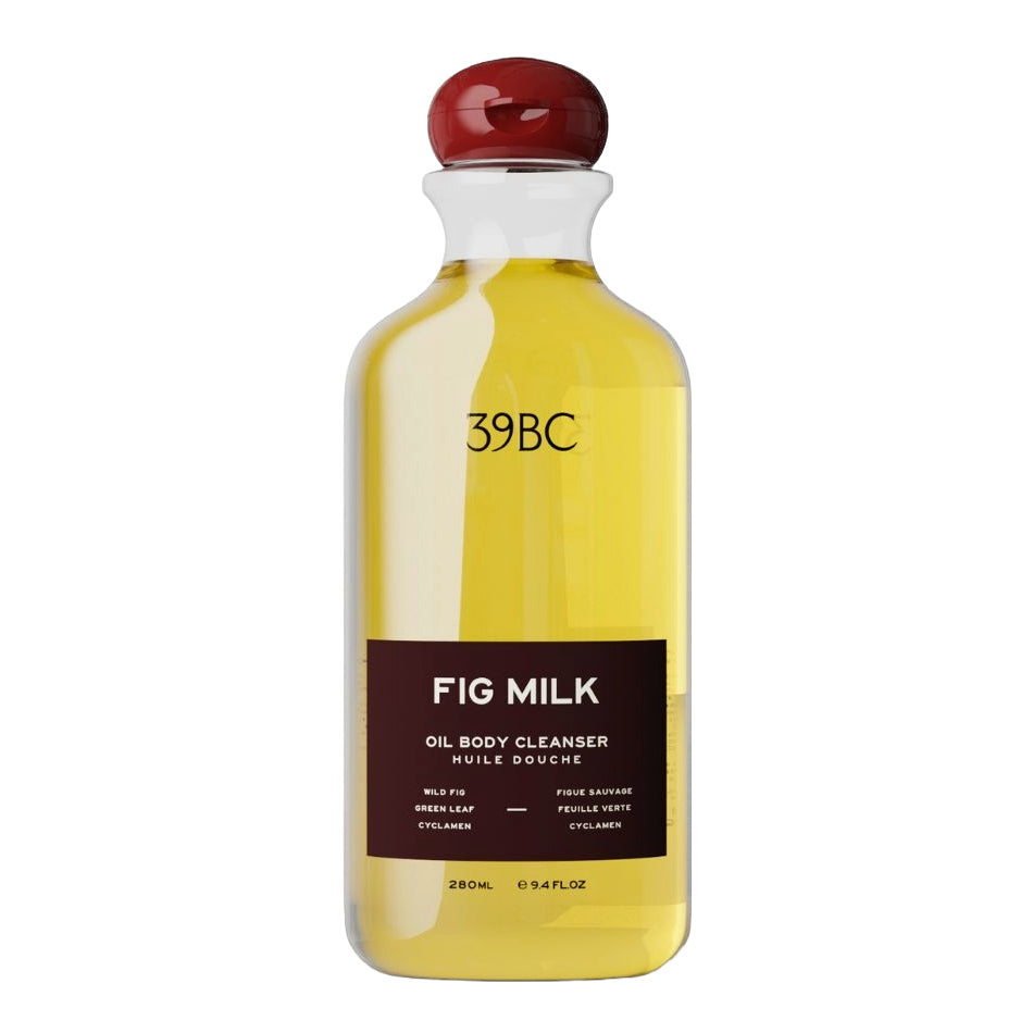 A 280ml bottle of 39BC Fig Milk Oil Body Cleanser, featuring a clear bottle filled with yellow oil, a dark brown label, and a glossy red cap, set against a plain white background.