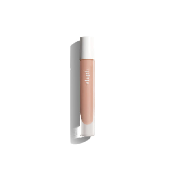 Aleph Lucid Lip Gloss/Balm – clear, glossy, and ultra-nourishing lip balm in a sleek vial.