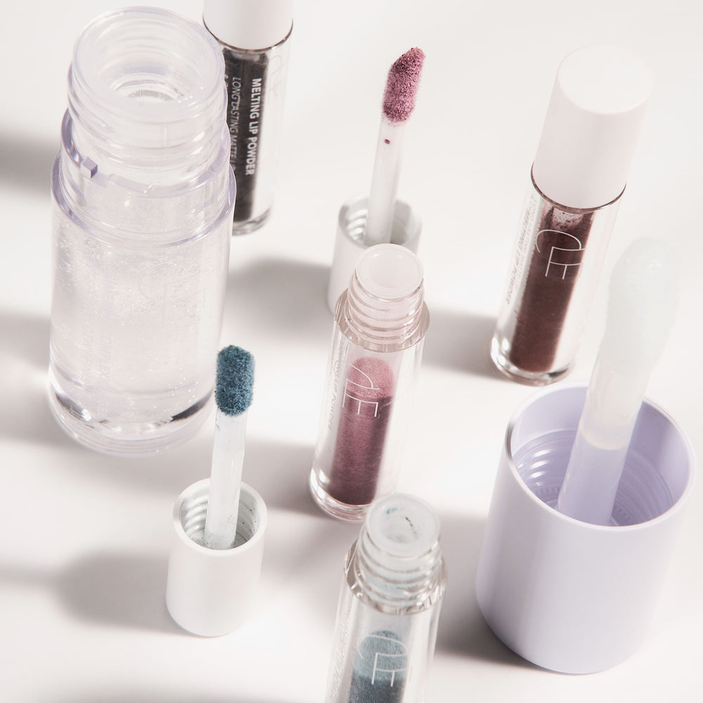CLE Cosmetics Color & Shine Set featuring the Glimmering Complexion Gel and four mini Melting Powders in vibrant, modern shades. A deluxe makeup set for a dewy, polished look.
