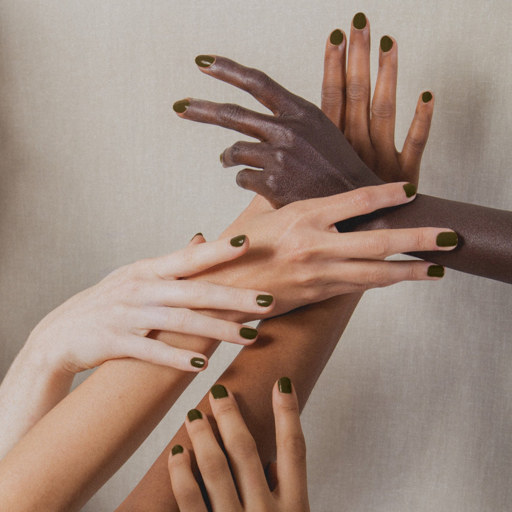 J. HANNAH Compost Nail Polish is a dark browny green color on white background