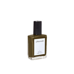 J. HANNAH Compost Nail Polish is a dark browny green color on white background