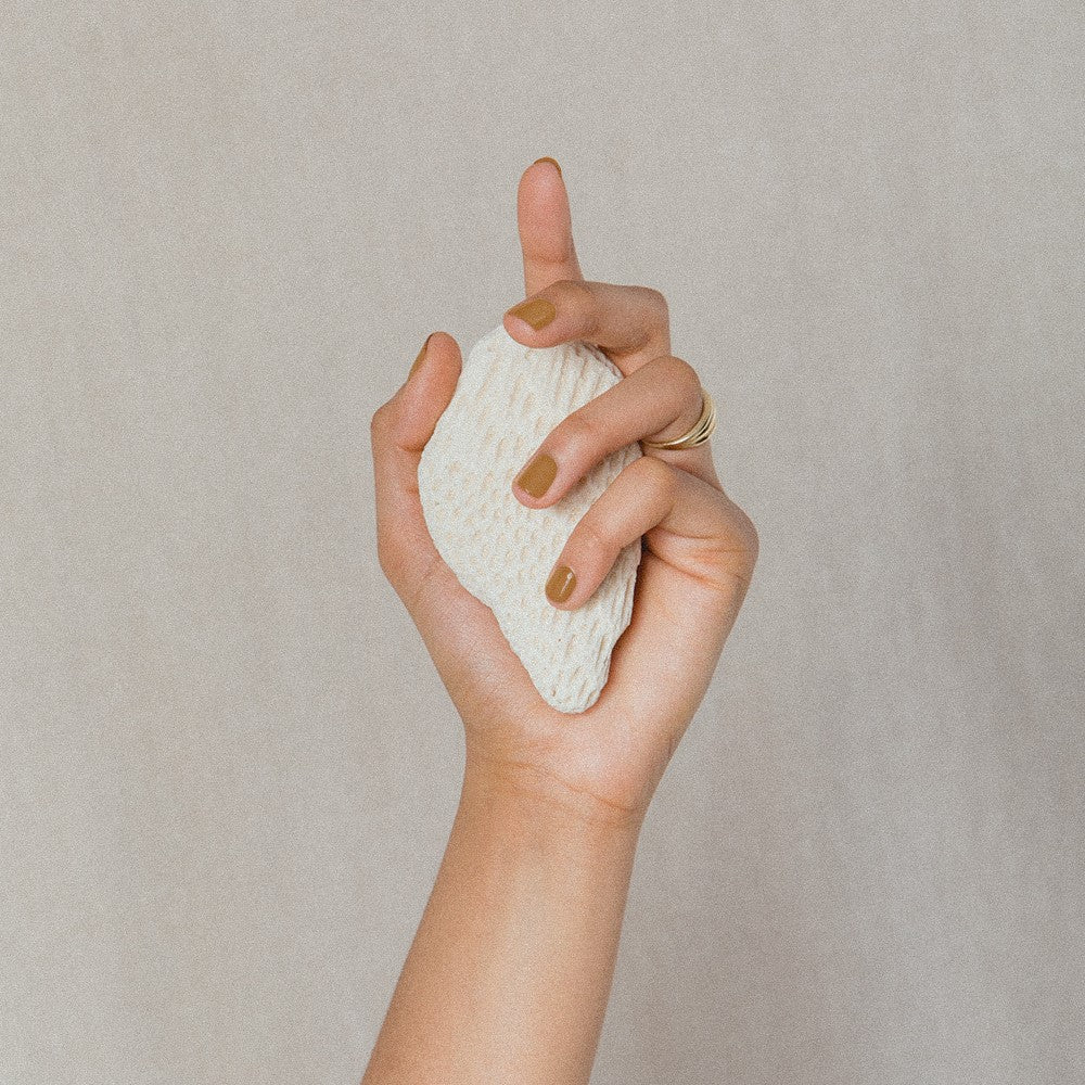 J. HANNAH Fauna Nail Polish is a dark browny orange, a dark curcuma color, on white background