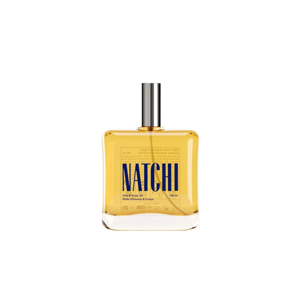 NATCHI Hair & Body Oil in a sleek bottle with spray top, designed to hydrate and nourish skin and hair naturally.
