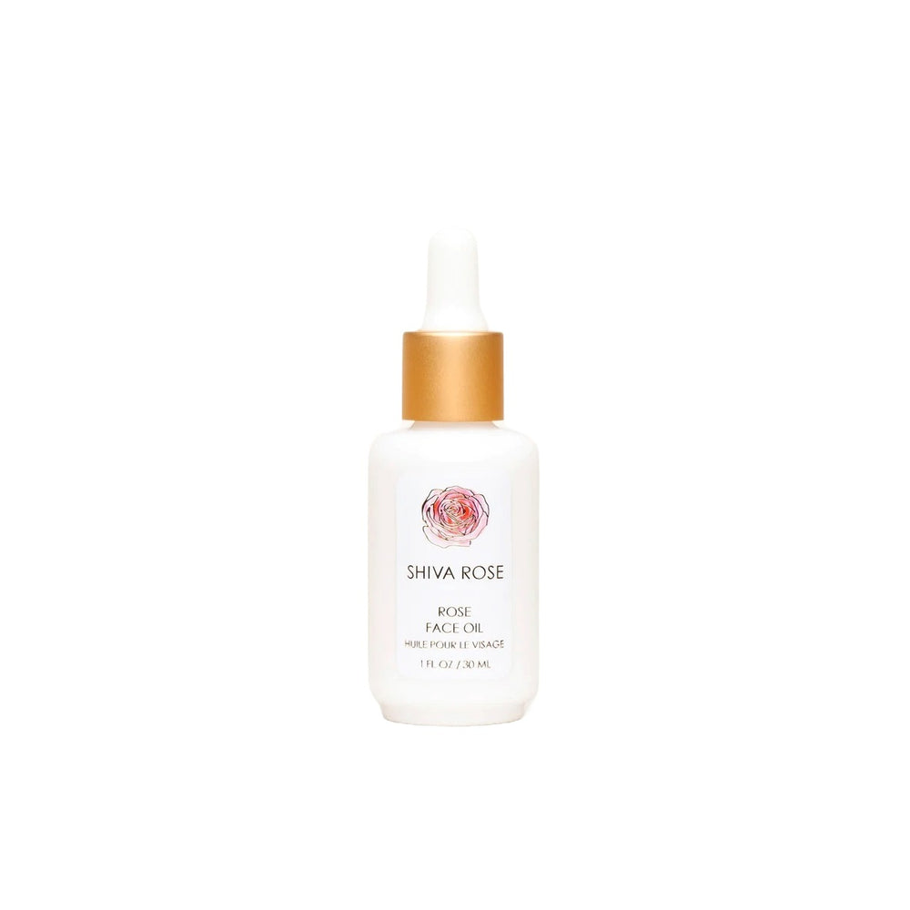 Hand-blended SHIVA ROSE Rose Face Oil with organic oils for skin nourishment, featuring key ingredients like jojoba and rosehip seed oil.