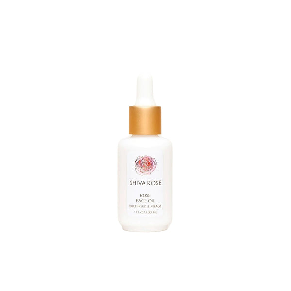 Hand-blended SHIVA ROSE Rose Face Oil with organic oils for skin nourishment, featuring key ingredients like jojoba and rosehip seed oil.