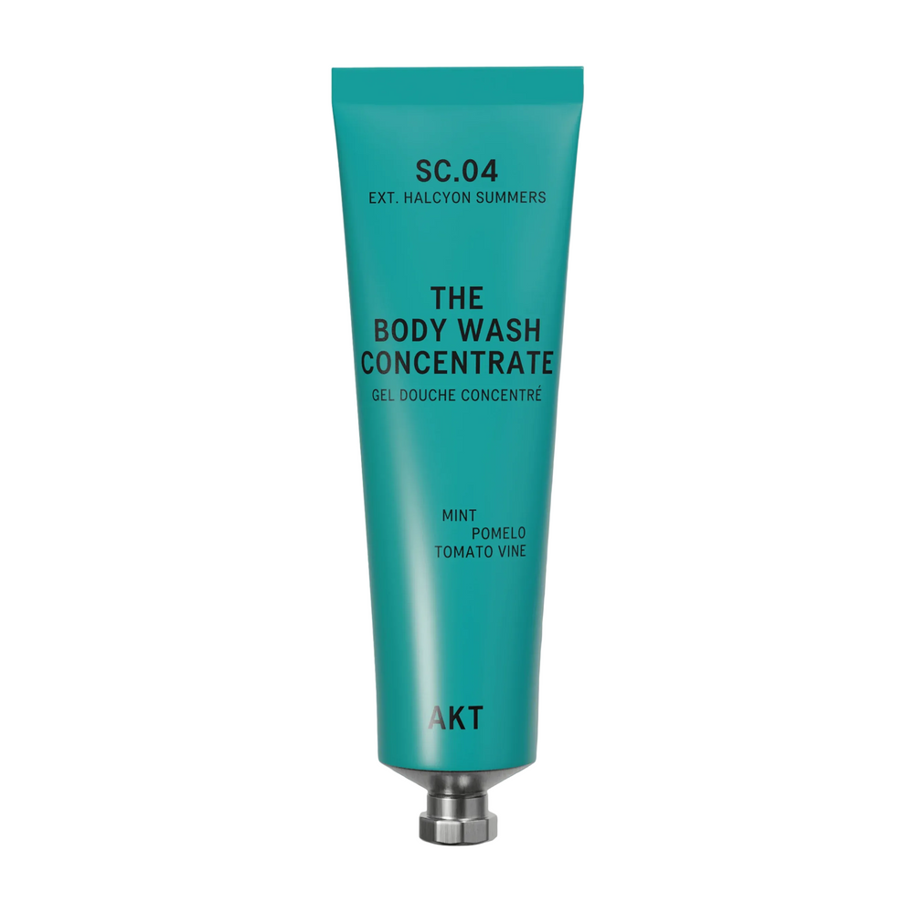A teal squeeze tube of AKT London body wash concentrate labeled 'SC.04 Halycon Summers, on white background.