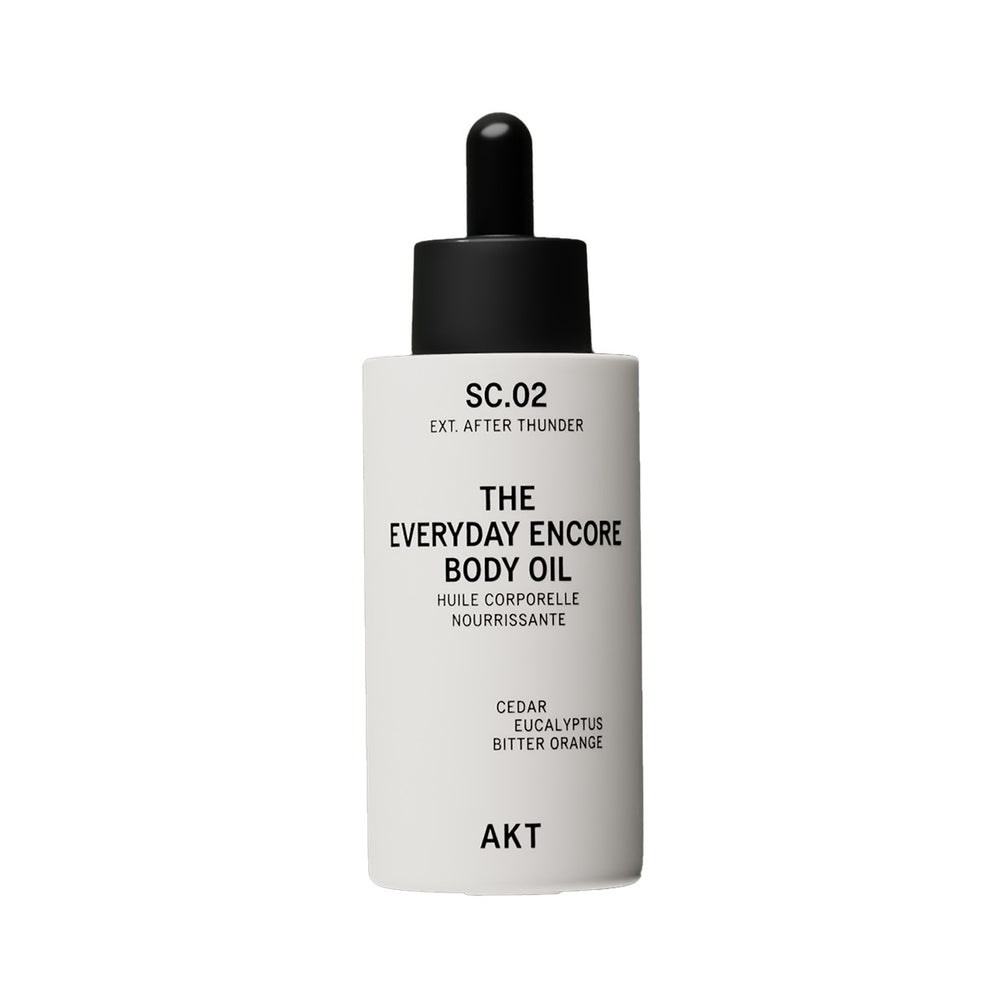 A white bottle with dropper of AKT London The Everyday Encore Body Oil with a scent SC.02 After Thunder, shown on a white background.