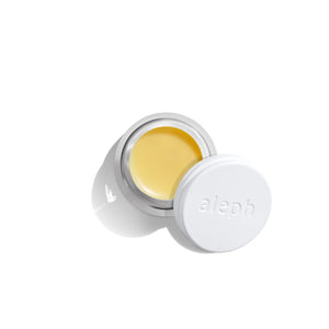 ALEPH Mixing Face Balm in glass jar with aluminium white lid on white background
