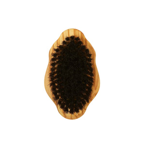 Wooden body brush with black bristles on a white background