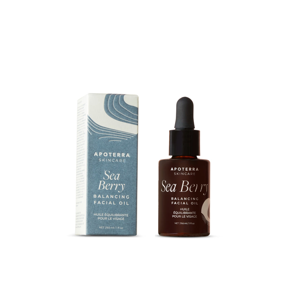 Apoterra Sea Berry Balancing Facial Oil bottle with natural ingredients like sea buckthorn berries and tamanu nuts.