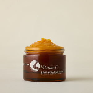Jar of Apoterra Vitamin C Regenerative Balm on a beige background