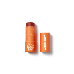 AXIOLOGY Tinted Dew Multi-Stick in Strength, sheer cherry red shade with warm undertones for lips, cheeks, and eyes, vegan plastic-free makeup