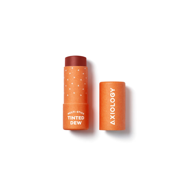 AXIOLOGY Tinted Dew Multi-Stick in Strength, sheer cherry red shade with warm undertones for lips, cheeks, and eyes, vegan plastic-free makeup