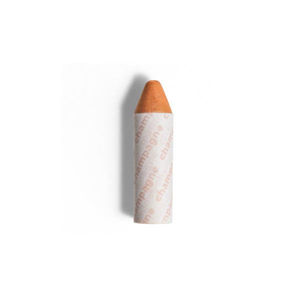 AXIOLOGY 3-in-1 Balmie Crayon Highlighter in Champagne, a plastic-free multi-use makeup crayon with a soft golden shimmer for eyes, lips, and cheeks.