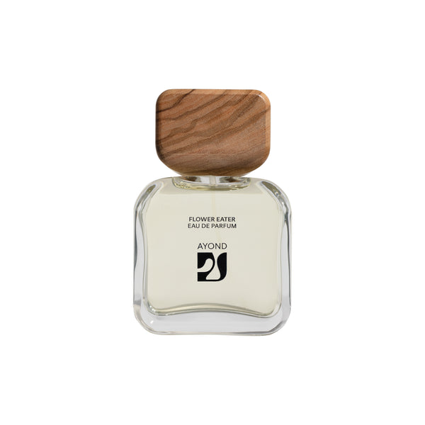 Perfume bottle with wooden cap from Ayond on a white background