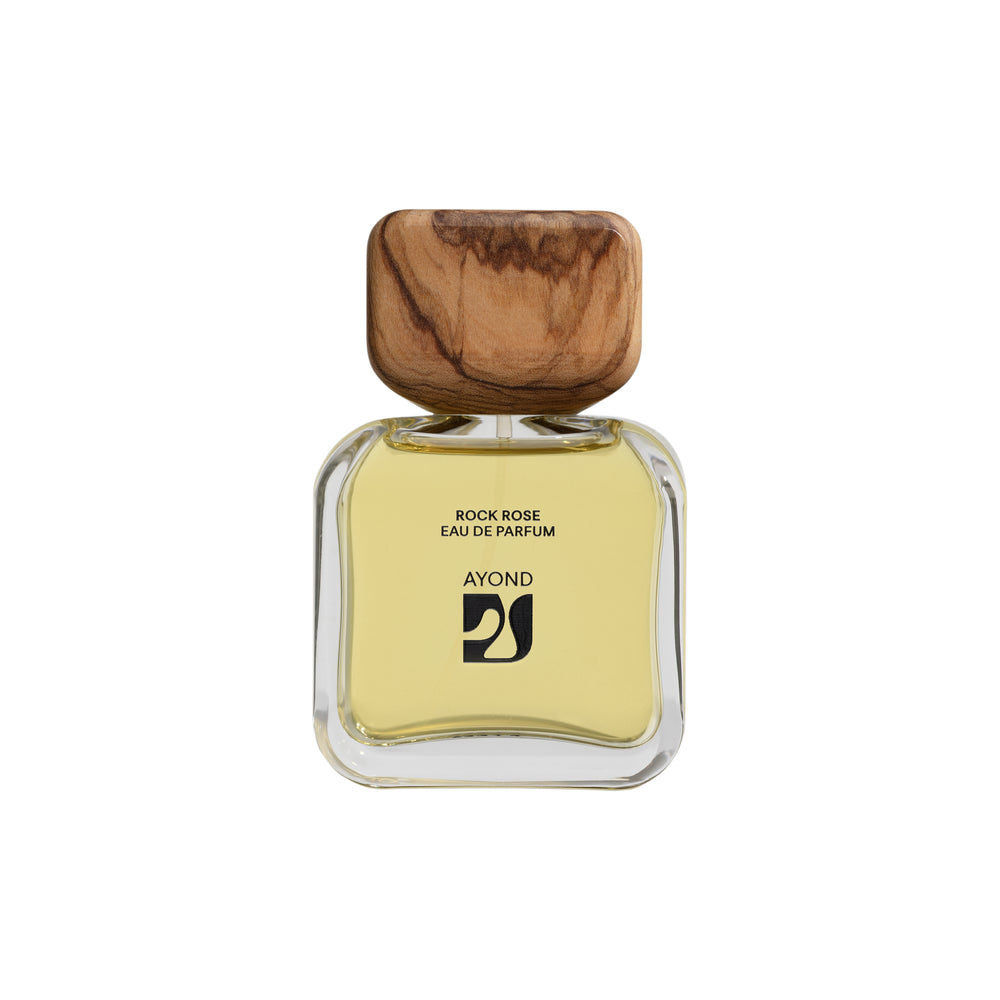 Perfume bottle with wooden cap from Ayond on a white background