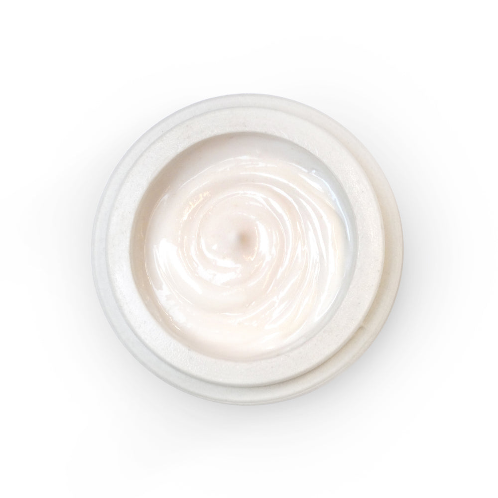 AYUNA Terra Eterna natural rejuvenating cream in a biodegradable ceramic jar with luxurious, rich, and melting texture.