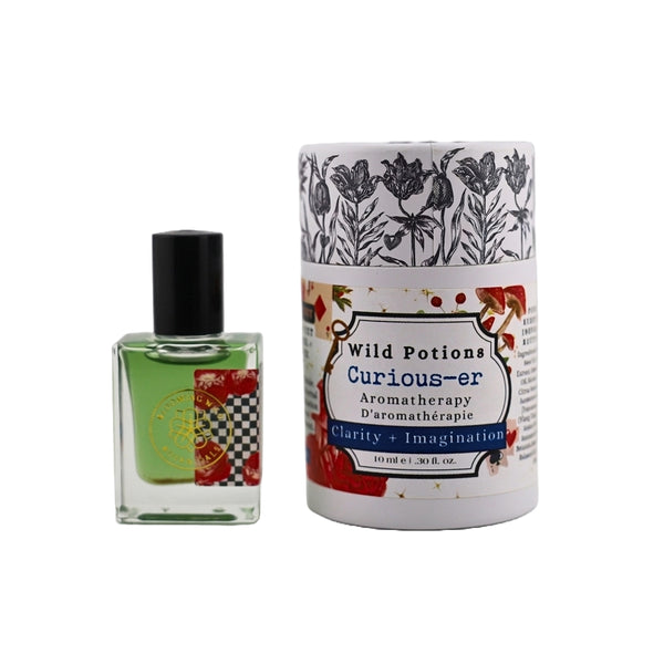Bottle and packaging of Wild Potions Curious-er aromatherapy product on a white background