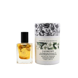 Perfume oil bottle and packaging with floral design on a white background