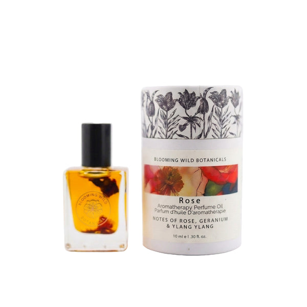Aromatherapy perfume oil bottle and packaging with floral design on a white background