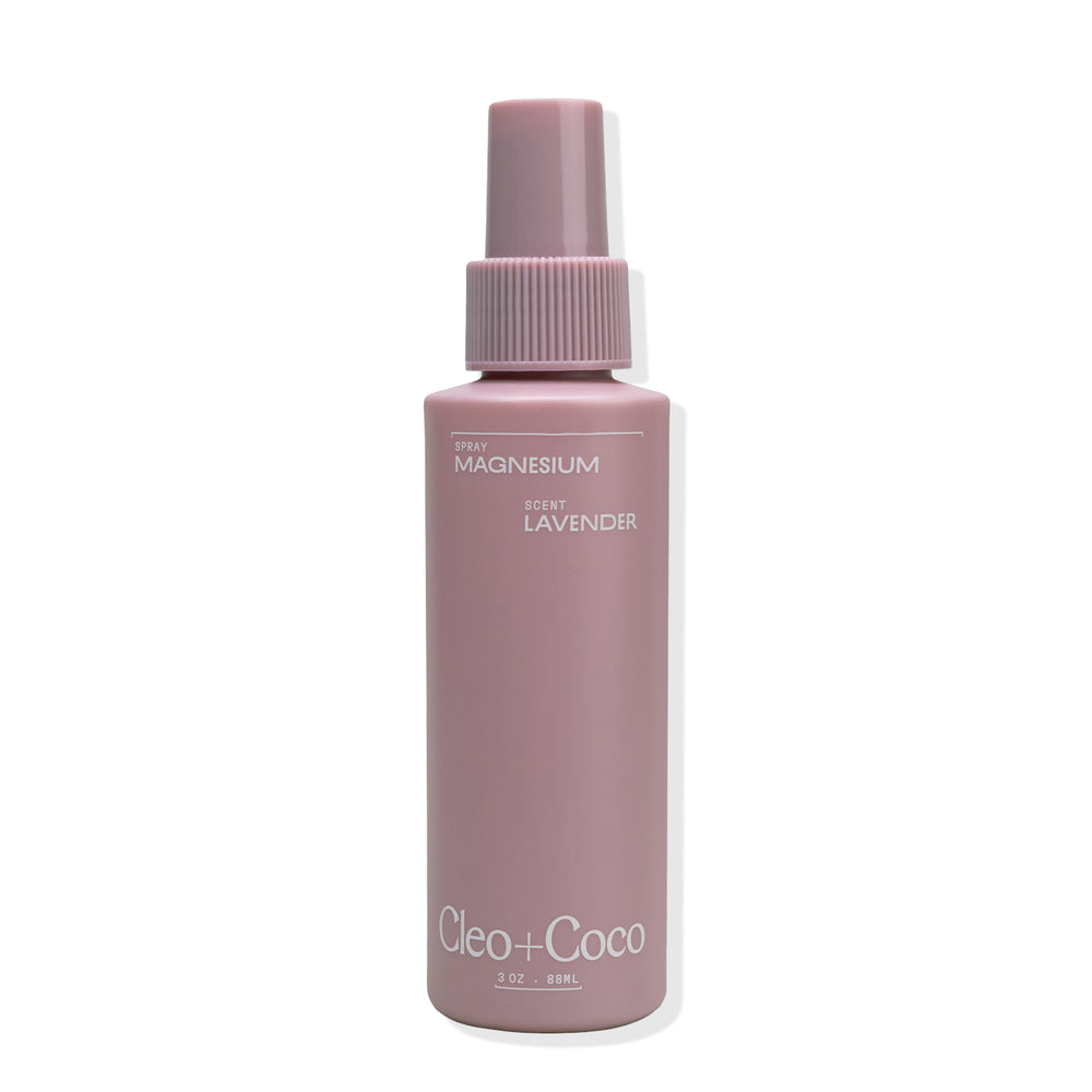 Pink bottle with a spray nozzle labeled 'Cleo + Coco' on a white background