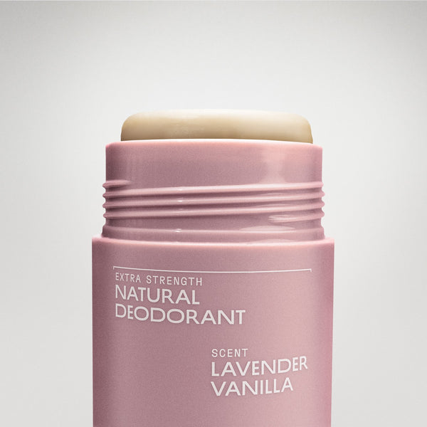 Pink deodorant stick with 'Extra Strength Natural Deodorant' and 'Lavender Vanilla' scent on a light gray background