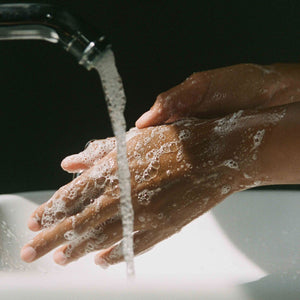 Hands being washed with soap and water under a faucet. CORPUS Aromatic Hand Wash Amalgam 7