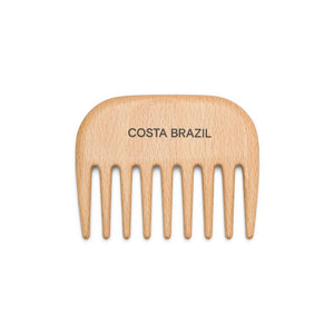 Wooden comb with 'Costa Brazil' branding on a white background