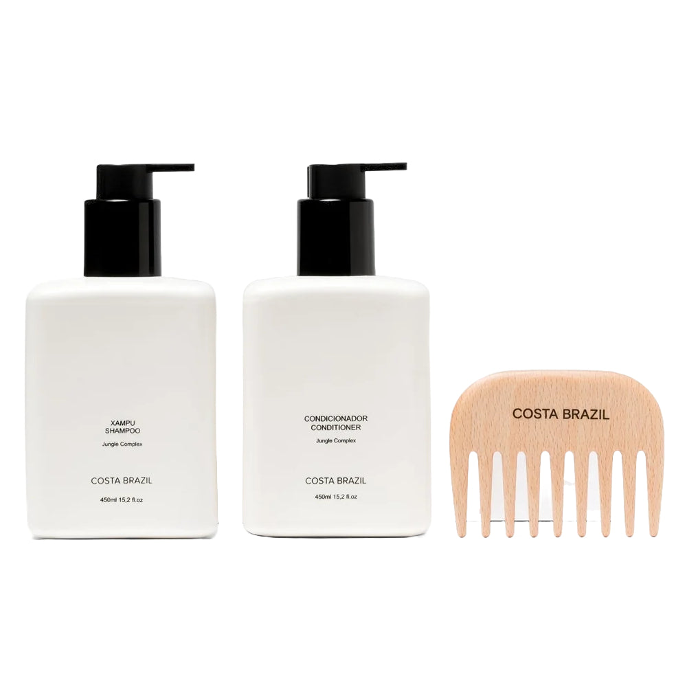 Two bottles of Costa Brazil shampoo and conditioner with a wooden comb on a white background