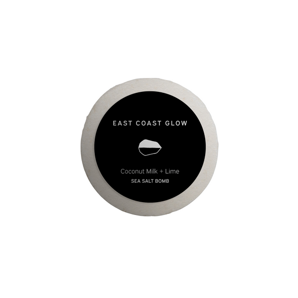 East Coast Glow Coconut Milk + Lime Salt of the Earth™ Sea Salt Bomb with organic coconut milk, lime essential oil, and wildcrafted botanicals for a nourishing and relaxing bath.