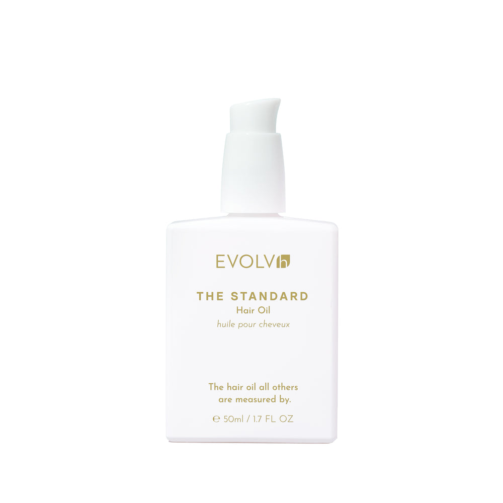 EVOLVh The Standard Hair Oil in white bottle with white pump.