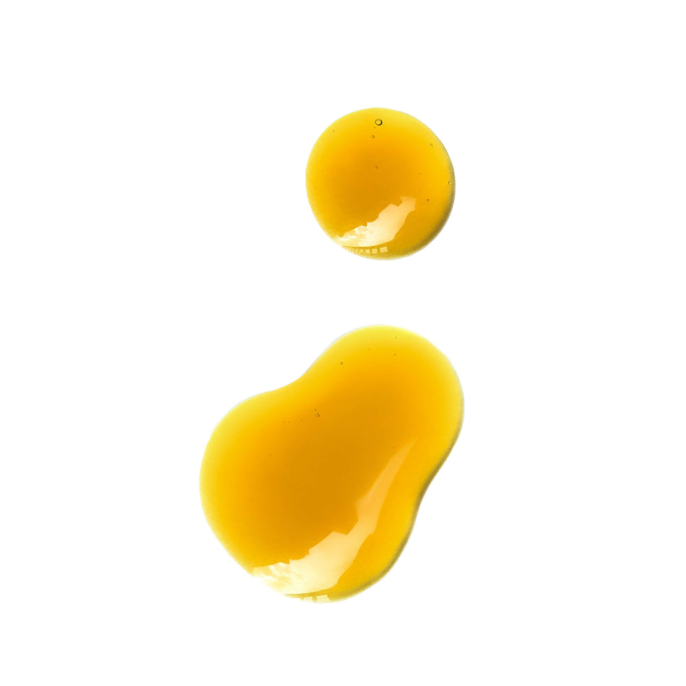 FIFTY7KIND TANU Skin Affinity Coactive Serum in a violet glass bottle, featuring a golden-hued formula with potent botanical ingredients.