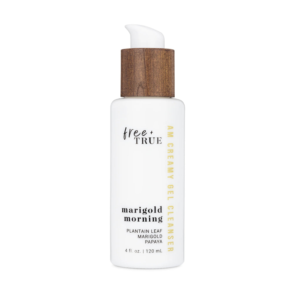 FREE + TRUE Marigold Morning AM Creamy Gel Cleanser in white glass bottle with white and bamboo pump on white background