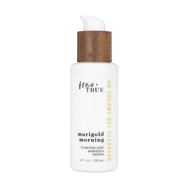 FREE + TRUE Marigold Morning AM Creamy Gel Cleanser in white glass bottle with white and bamboo pump on white background