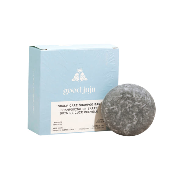 Good Juju Scalp Care Shampoo Bar in its packaging beside the solid bar, shown as a natural, eco friendly hair care product designed for gentle scalp cleansing.