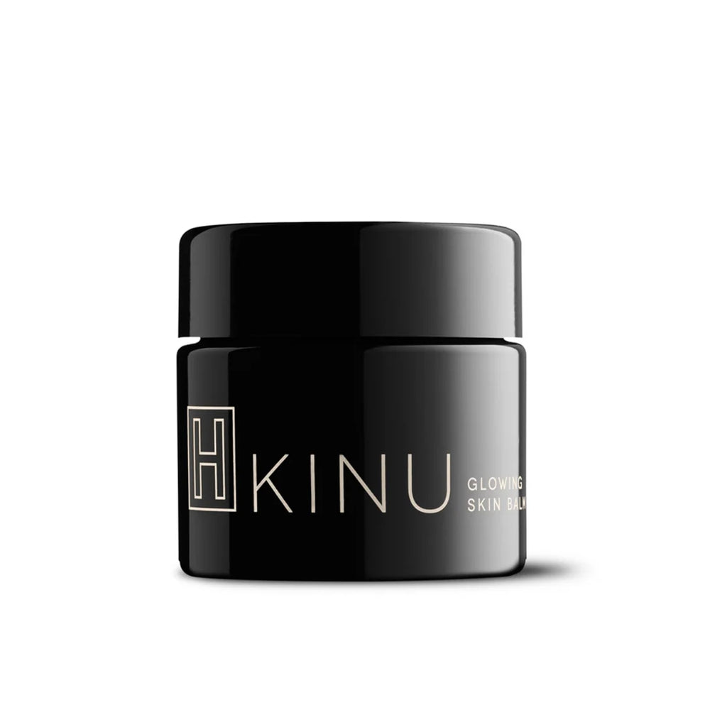 Black glass jar of H IS FOR LOVE -INU Glowing Body Balm on a white background