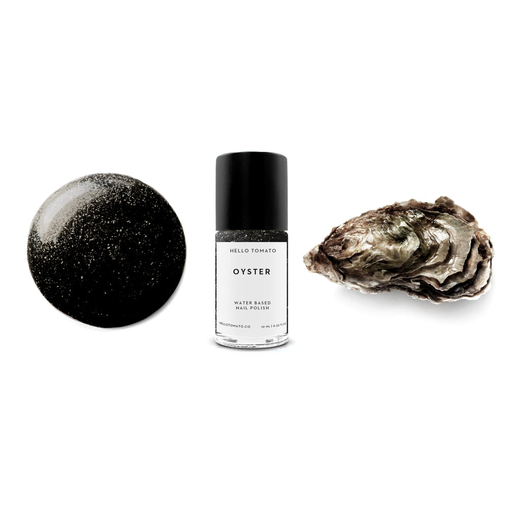 HELLO TOMATO Oyster nail polish, an almost black color with specks of multicolored sparkles, reminiscent of one of nature’s handmade jewels.