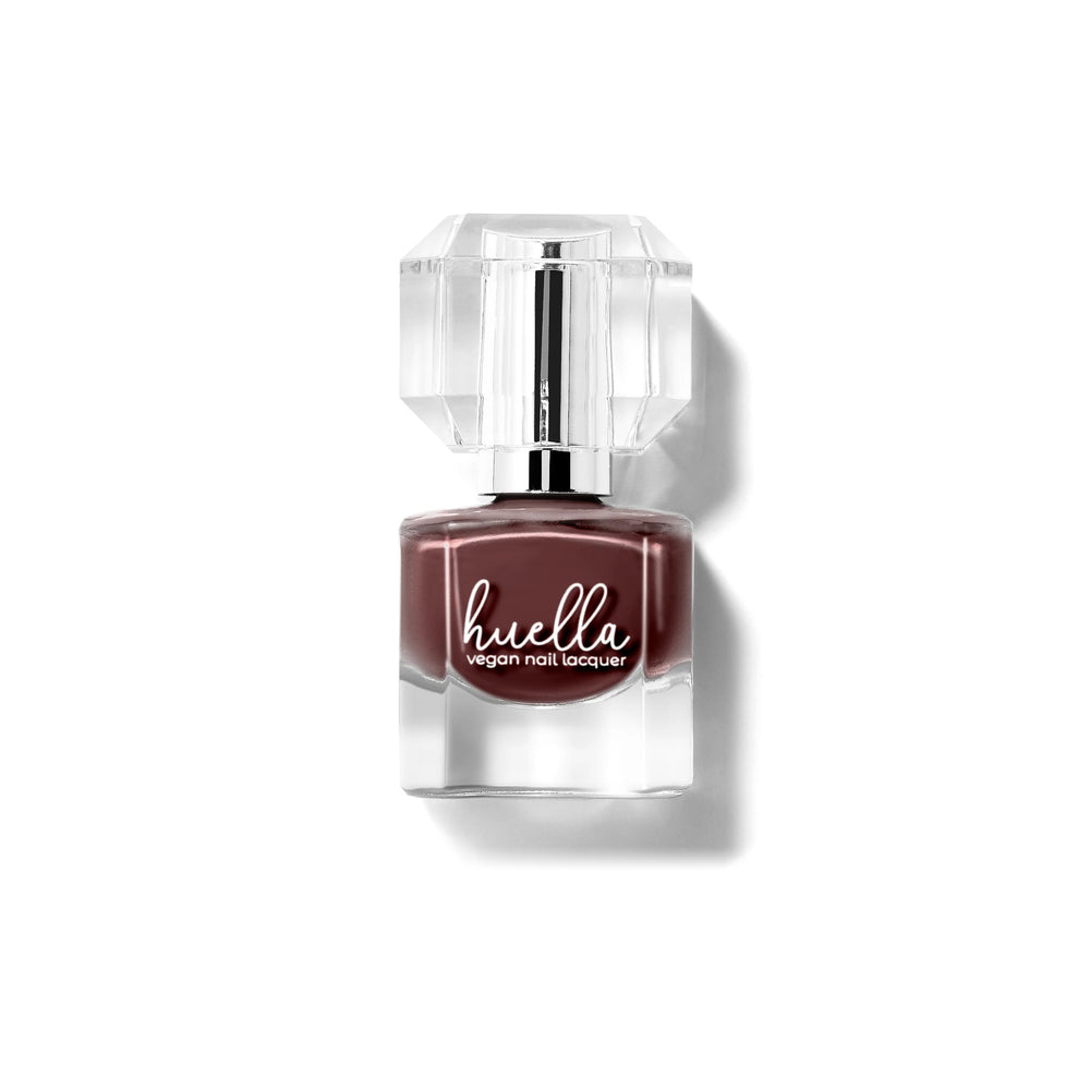 Huella Café Noir nail lacquer in a deep coffee brown shade with cherry undertones, featuring a 15-free, vegan, and chip-resistant formula.