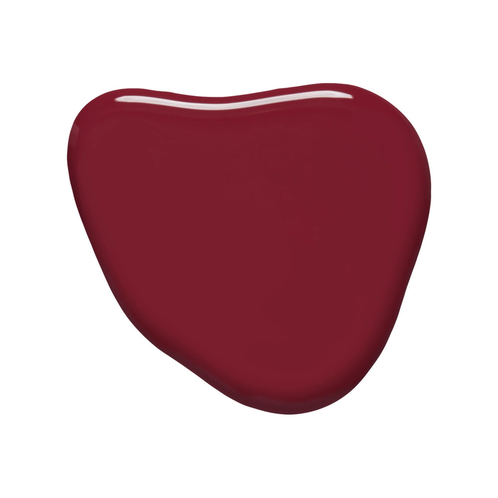 Huella Heartbreaker nail lacquer in a rich burgundy shade with plum undertones, featuring a 15-free, vegan, and chip-resistant formula.