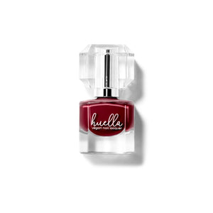 Huella Lifted Soul nail lacquer in a true deep red shade, featuring a 15-free, vegan, and chip-resistant formula.