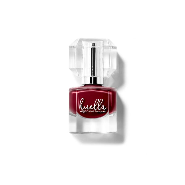 Huella Lifted Soul nail lacquer in a true deep red shade, featuring a 15-free, vegan, and chip-resistant formula.