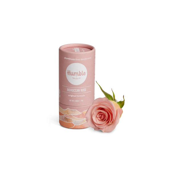 Pink deodorant container with a rose on a white background