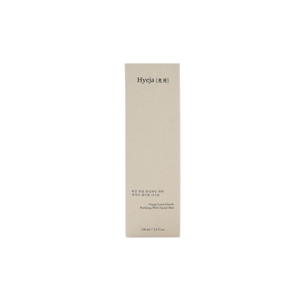 HYEJA Vegan Lotus Clarifying Gentle PHA Facial Mist in glass bottle with golden spray mister on white background. The bottle is light green color but still clear.