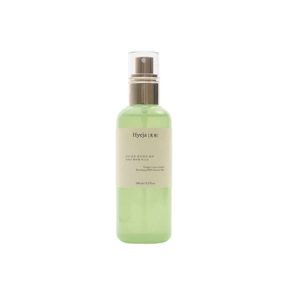 HYEJA Vegan Lotus Clarifying Gentle PHA Facial Mist in glass bottle with golden spray mister on white background. The bottle is light green color but still clear.
