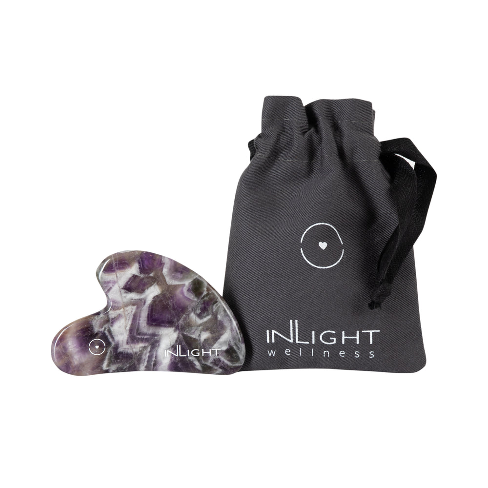 INLIGHT BEAUTY Amethyst Gua Sha massage tool designed for a soothing facial ritual to enhance skin appearance and promote a refreshed, toned look.