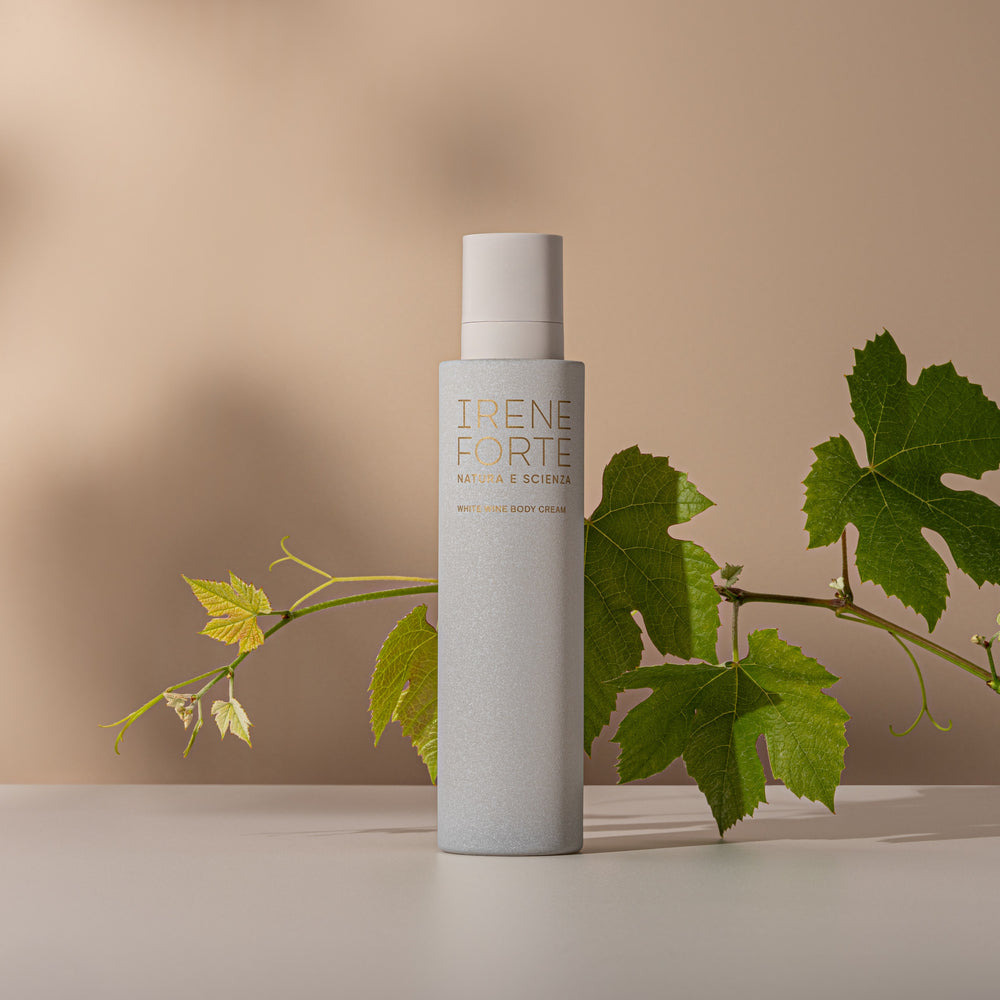Irene Forte white wine body cream bottle and packaging on a white background. Irene Forte White Wine Body Cream – a luxurious 200ml body moisturizer enriched with organic white wine and hyaluronic acid.